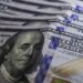 Dólar cai para R$ 5 e fecha no menor valor em dez meses